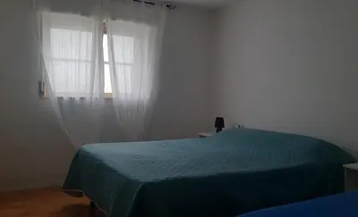 Letto o letti in una camera di casa vacanza le bleu et le vert a 180 mt dal mare