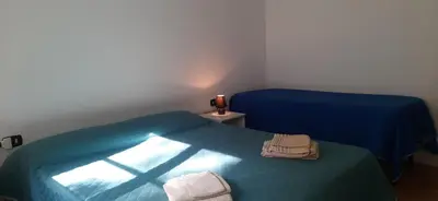 Letto o letti in una camera di casa vacanza le bleu et le vert a 180 mt dal mare