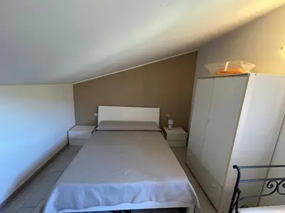 Letto o letti in una camera di Casa Laura