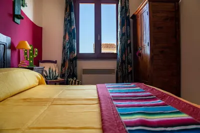 Letto o letti in una camera di Nora Guesthouse Rooms and Villas