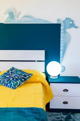 Letto o letti in una camera di Nora Guesthouse Rooms and Villas