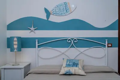 Letto o letti in una camera di Nora Guesthouse Rooms and Villas