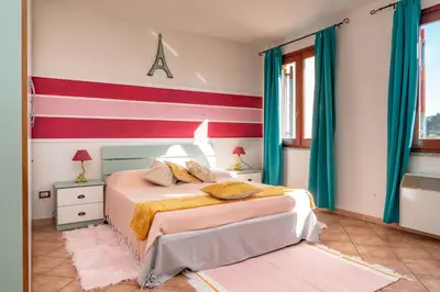 Letto o letti in una camera di Nora Guesthouse Rooms and Villas