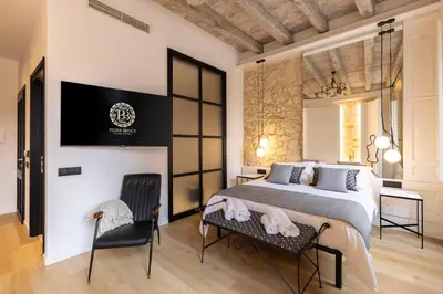 Letto o letti in una camera di Pedra Bianca Luxury Rooms