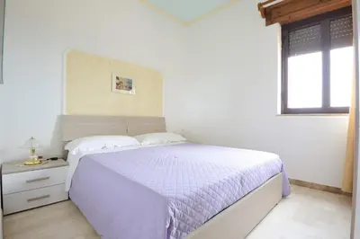 Letto o letti in una camera di Appartamento Mariolu 1