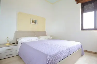 Letto o letti in una camera di Appartamento Mariolu 1