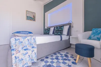 Letto o letti in una camera di Capo Norax chambre de luxe avec jacuzzi à 250m de la mer