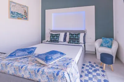 Letto o letti in una camera di Capo Norax chambre de luxe avec jacuzzi à 250m de la mer