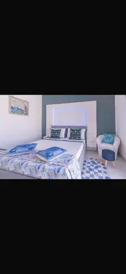 Letto o letti in una camera di Capo Norax chambre de luxe avec jacuzzi à 250m de la mer