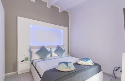 Letto o letti in una camera di Capo Norax chambre de luxe avec jacuzzi à 250m de la mer
