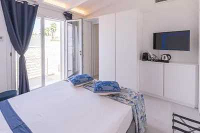 Letto o letti in una camera di Capo Norax chambre de luxe avec jacuzzi à 250m de la mer