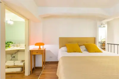 Letto o letti in una camera di HomeToLove Villanova
