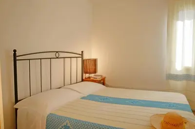 Letto o letti in una camera di Appartamento con cortile