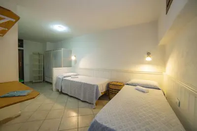 Letto o letti in una camera di Villetta Seaside Sardegna