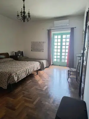 Letto o letti in una camera di Villa Carboni