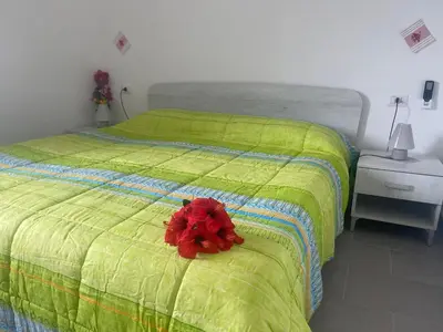 Letto o letti in una camera di Villa Nido dei Passeri