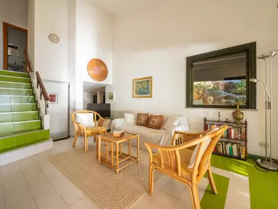 Area soggiorno di Holiday Home Capo Boi by Interhome