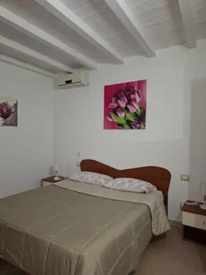 Letto o letti in una camera di Sa Festa Manna