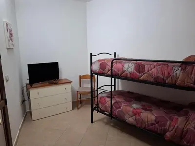 Letto o letti in una camera di Sa Festa Manna