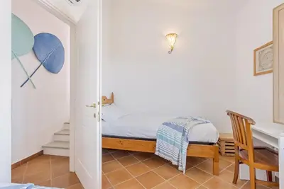 Letto o letti in una camera di Casa Lulù