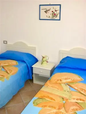 Letto o letti in una camera di Villas with shared pool in Costa Rei just 500 meters from the sea