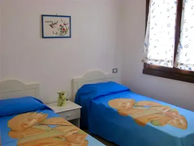 Letto o letti in una camera di ISA-Villas with shared pool in Costa Rei just 500 meters from the sea