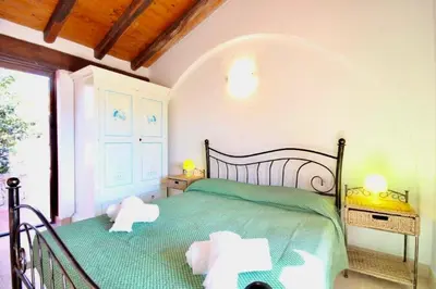 Letto o letti in una camera di ISA - Villas with private pool in Costa Rei just 500 meters from the sea