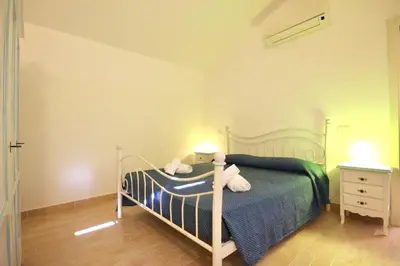 Letto o letti in una camera di ISA - Villas with private pool in Costa Rei just 500 meters from the sea
