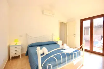 Letto o letti in una camera di ISA - Villas with private pool in Costa Rei just 500 meters from the sea
