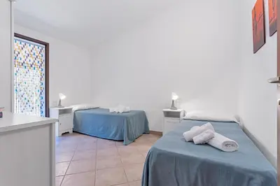 Letto o letti in una camera di La Casa Azzurra