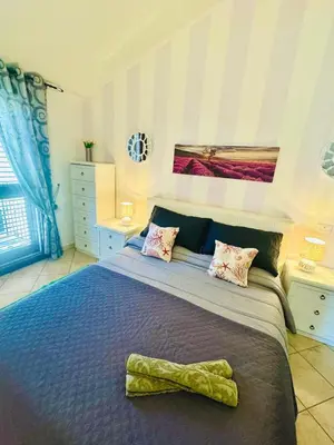 Letto o letti in una camera di Casa Terrazza 9 Sardegna