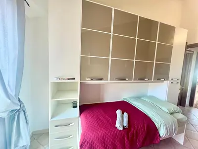 Letto o letti in una camera di Casa Terrazza 9 Sardegna