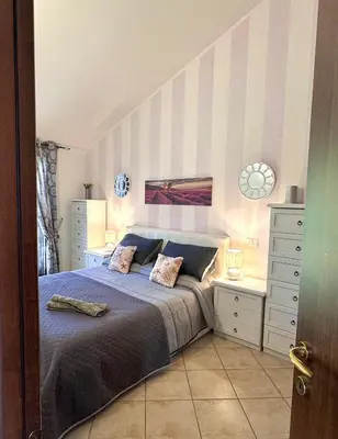 Letto o letti in una camera di Casa Terrazza 9 Sardegna