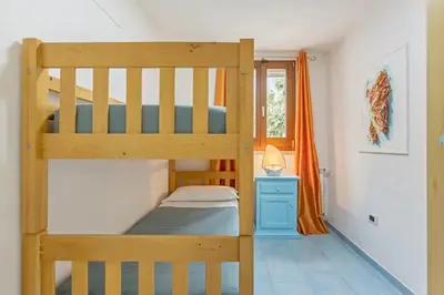 Letto o letti in una camera di Villa Mari