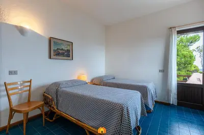 Letto o letti in una camera di Villa Le Sirene on the beach