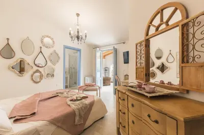 Letto o letti in una camera di B&B Antico Telaio