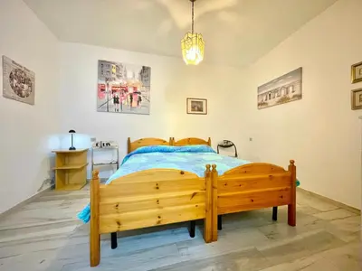 Letto o letti in una camera di La Corte Azzurra Room