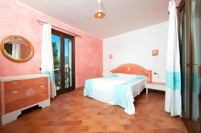 Letto o letti in una camera di Residence with swimming-pool in Campulongu just 600 mt from the sea