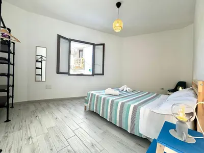 Letto o letti in una camera di Le Corti Sarde Village