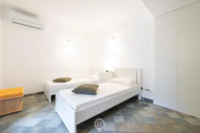 Letto o letti in una camera di Fiorenza's charming beach house