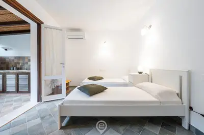 Letto o letti in una camera di Fiorenza's charming beach house