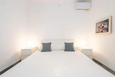 Letto o letti in una camera di Fiorenza's charming beach house