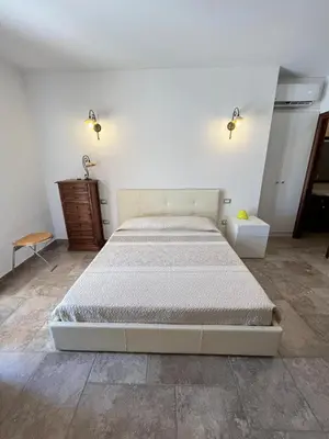 Letto o letti in una camera di Attico Via Roma Villasimius