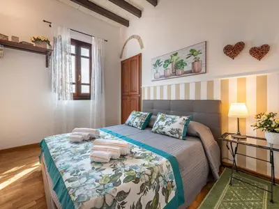Letto o letti in una camera di Charm in Villanova