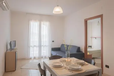 Area soggiorno di Le Fontane Apartments In Villasimius