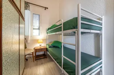Letto o letti in una camera di Brezza di Geremeas, Walk to the beach