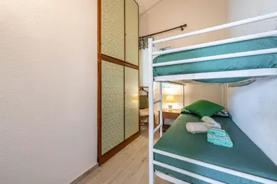 Letto o letti in una camera di Brezza di Geremeas, Walk to the beach