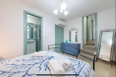Letto o letti in una camera di Villa Acquamarina a 2 passi dal mare