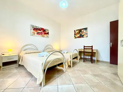 Letto o letti in una camera di La Margherita