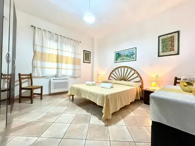 Letto o letti in una camera di La Margherita
